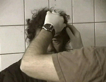 Video image of captured former Iraqi leader Saddam Hussein undergoing mediacal examonations, Baghdad, December 14, 2003.